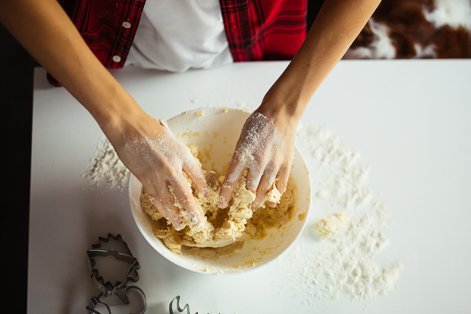 Student kneading dough